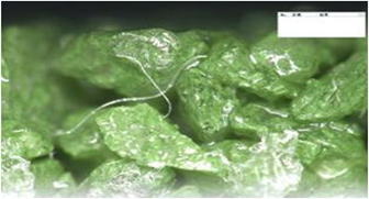 スリップレイトシグマ03 色番DGR-01での混入済み繊維の絡み状況の写真
